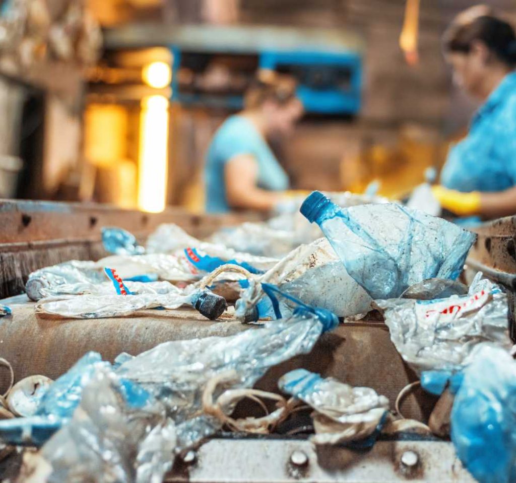 plastic-garbage-conveyor-belt-waste-recycling-factory-workers-background (1)